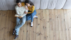 top view lovely couple reading book