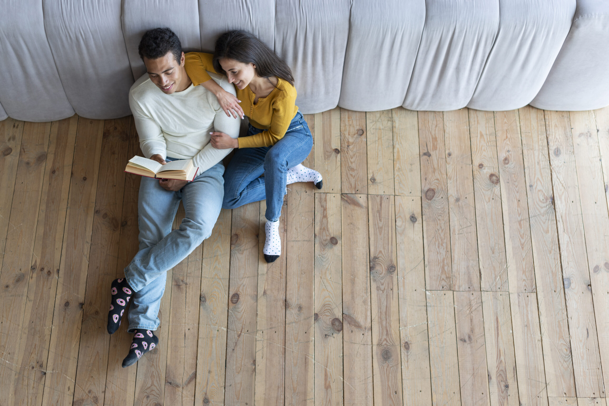 top view lovely couple reading book scaled